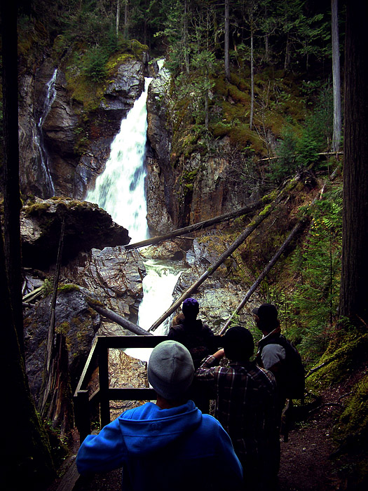 Hikers at Begbie Falls in Revelstoke, BC