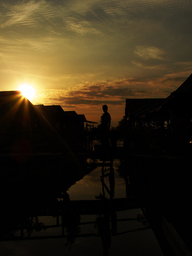 V on the guesthouse bridge at sunset