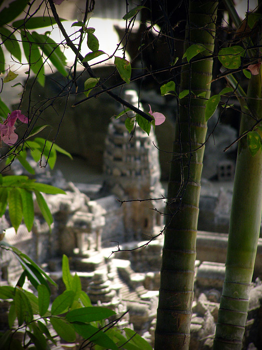 Angkor Wat miniature framed by vegetation